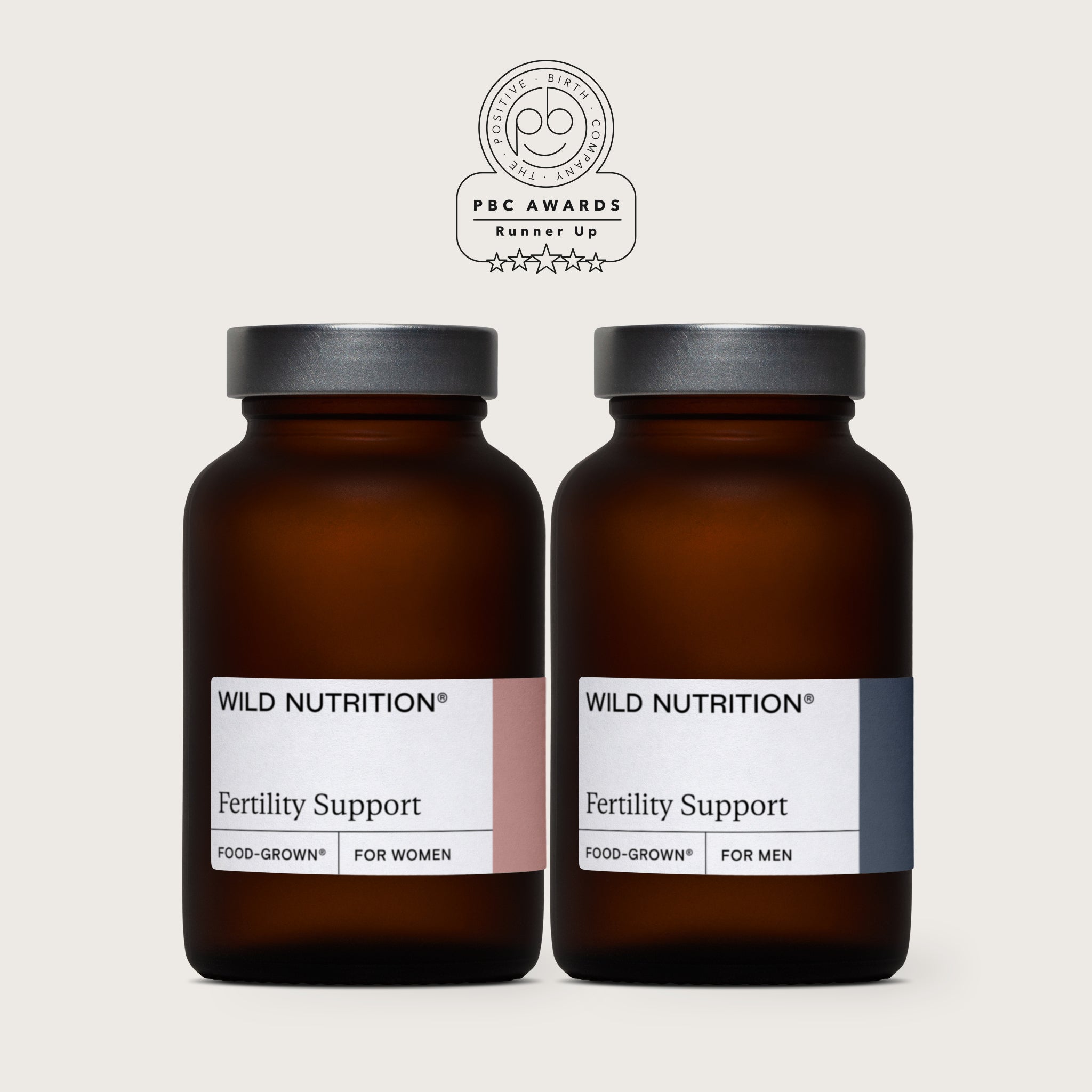 Wild Nutrition Fertility Support supplements for women and men in amber bottles, awarded runner-up in the Positive Birth Company PBC Awards
