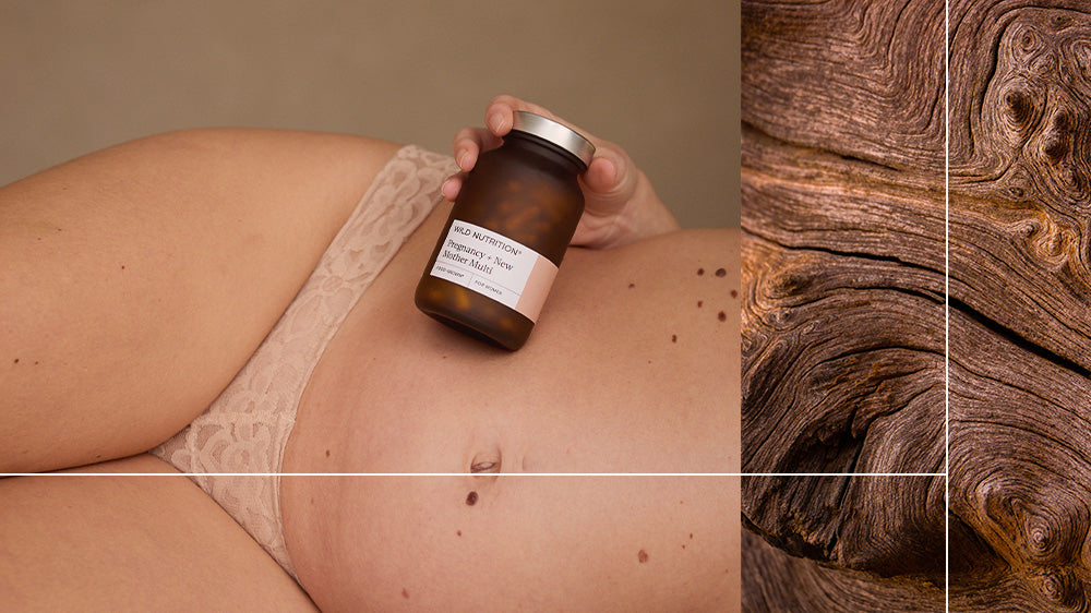 Pregnant lady holding a jar of supplements - Wild nutrition - Pregnancy Multi Vitamin