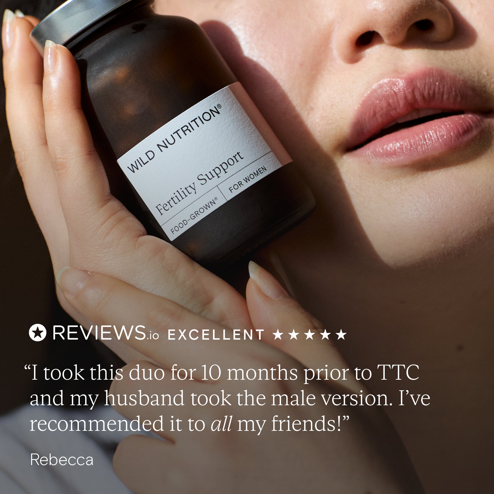Woman holding Wild Nutrition Fertility Support supplement with positive review quote for preconception advice.