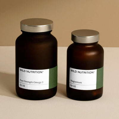 Wild Nutrition Healthy Heart Duo featuring Pure Strength Omega 3 and Magnesium in amber glass jars.