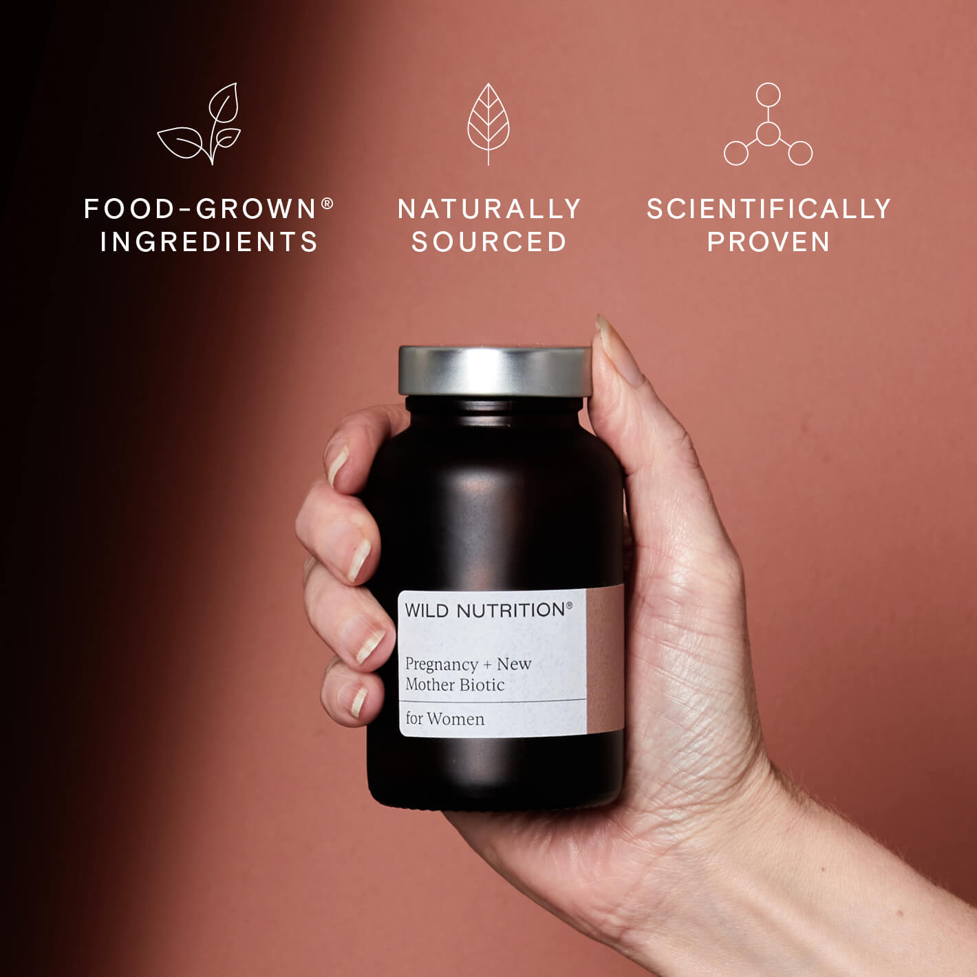 Wild Nutrition Pregnancy + New Mother Biotic bottle featuring food-grown, naturally sourced, scientifically proven ingredients.