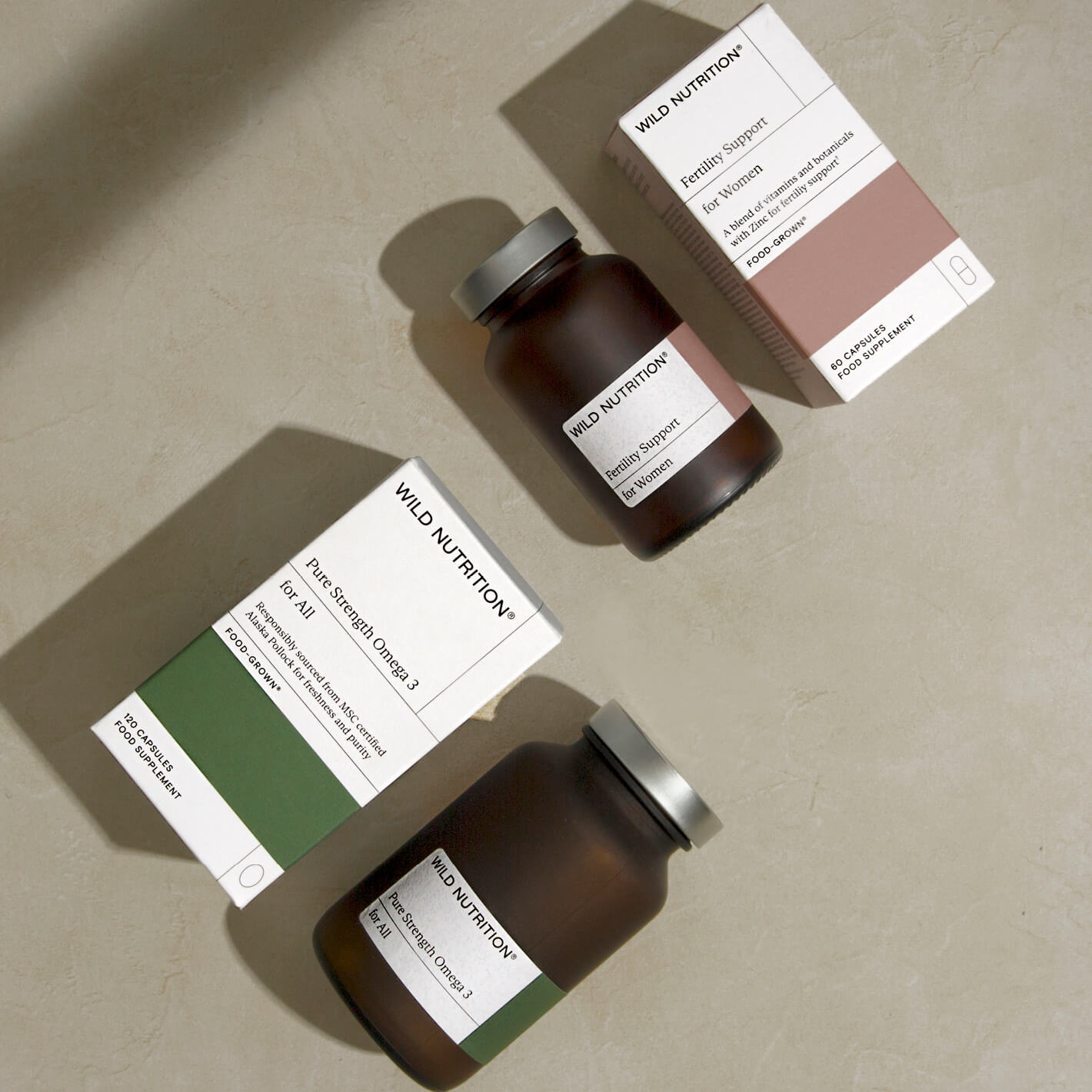 Women's Fertility Duo from Wild Nutrition: Food-Grown Fertility Support and Pure Strength Omega 3 capsules.